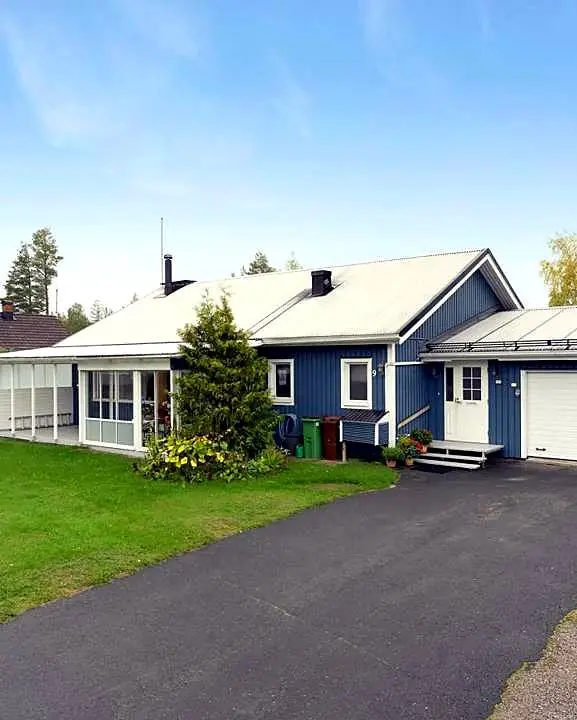 Three-bedroom home with sauna, guest cabin, two heated garages and a 2025 sunroom