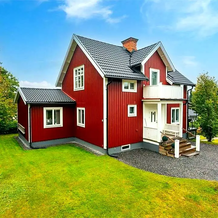 Classic 1914 red house with four bedrooms across three levels