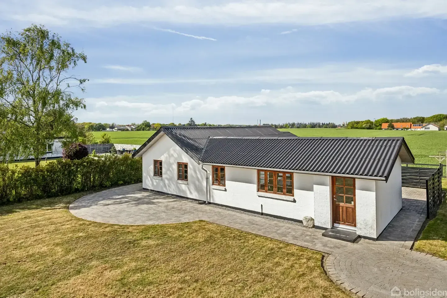 White country house with field views at the end of a lane