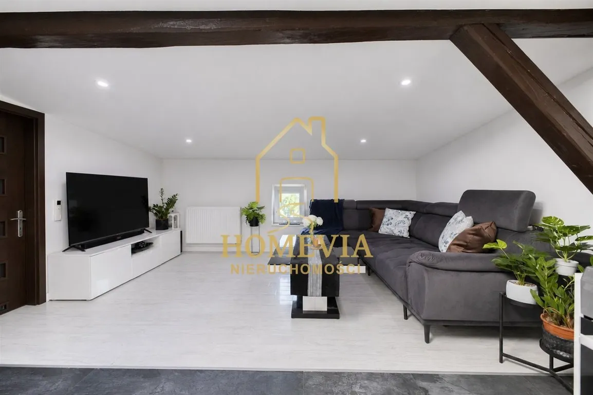 Designer attic flat with wooden beams and air conditioning in Bytom