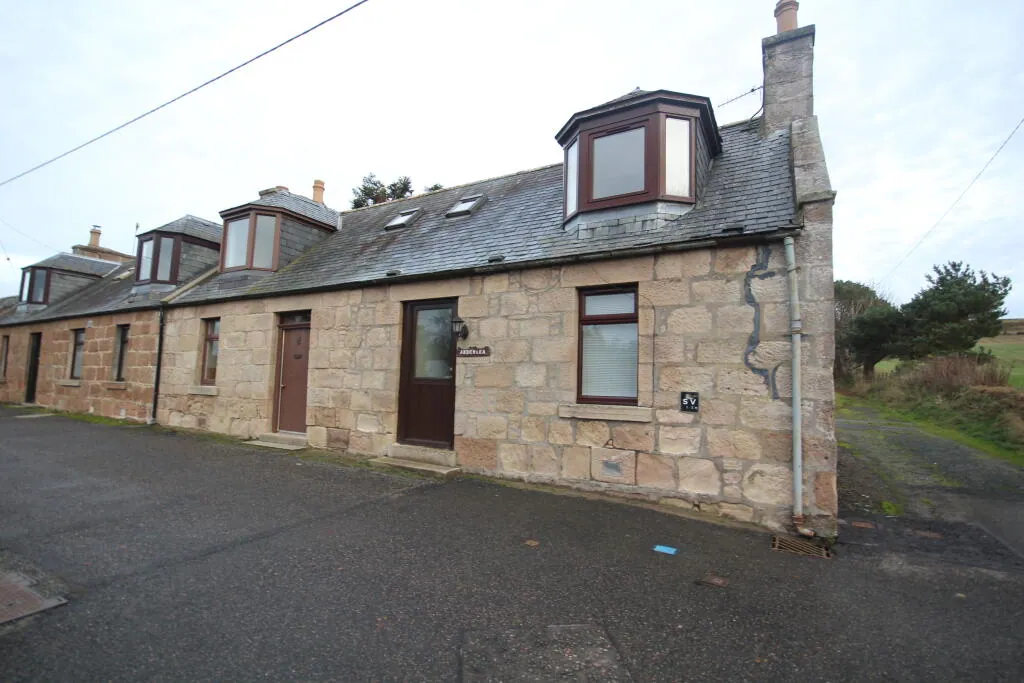 Traditional stone cottage on the village square
