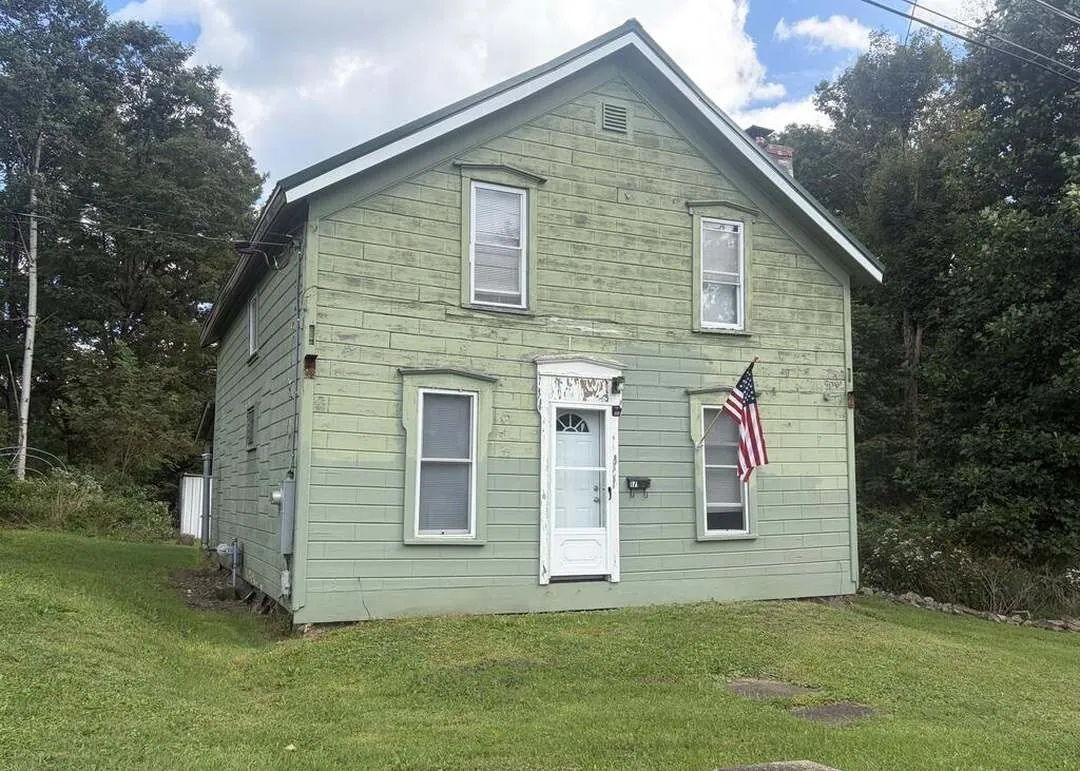 Old train depot house with a river view, sold furnished